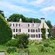 An ivy-covered library and flower garden on the grounds of the Peacefield residence